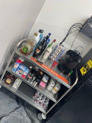 This is the cutest, most amazing little drink station. Enjoy a nicely crafted adult beverage while you're getting serviced.