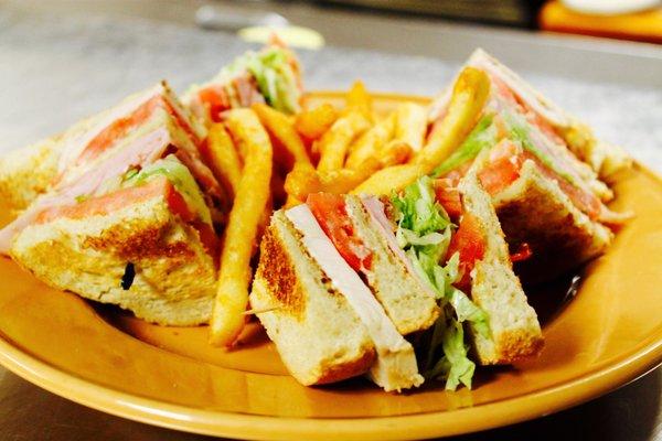 Turkey Club and crispy fries