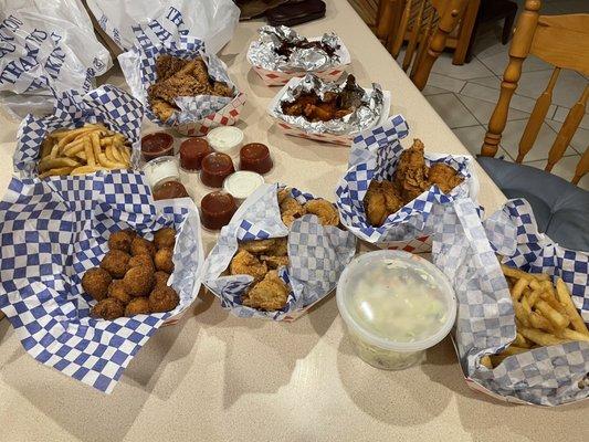 Shrimp, hot wings, fish fillets, chicken strips, fries, & hush puppies