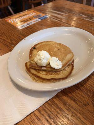 Cold pancakes with butter sitting on top