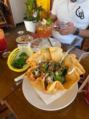 Tostada salad with chicken, shrimp cocktail & shrimp taco