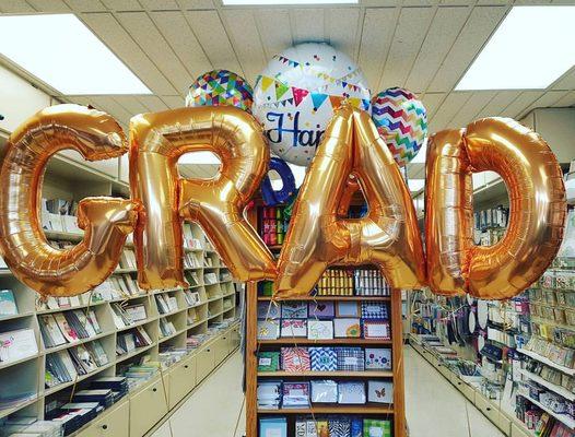 We carry in stock  a full alphabet of 40" tall gold mylar letter balloons as well as # symbols and & symbols.