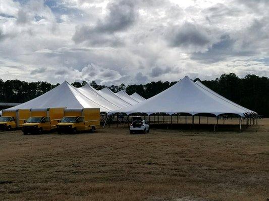 Two of our 60' wide pole tents.  We have small tents for a few people as well as large tents for several thousand people.  Call us today.