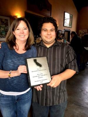 Windward Winery is resented with their Solar Energy plaque.