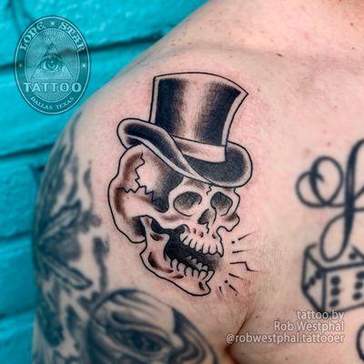 A rather dapper skull tattoo by @robwestphal.tattooer! For more classic tattoos like this one, fill out the contact form on our website!