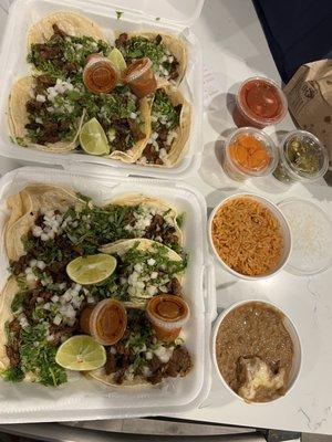 10 street tacos. 5-in one box, 5-in the other, Rice and beans, jalapeños and carrots, hot sauce and salsa