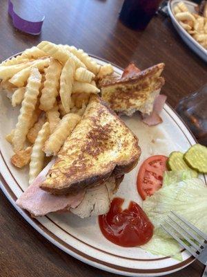 Monte Cristo Sandwich with side of fries.