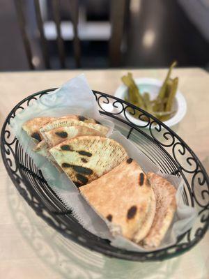 Complimentary pita bread & pickles