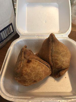 Hot samosas. Crunchy outside and soft and juicy inside (filled with potatoes and peas). Very yummy if you eat it hot.