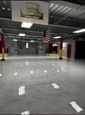 Warehouse garage floor epoxy done in metallic white