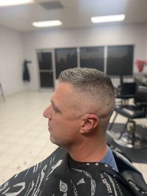 Adam getting the military hi n tight razor fade