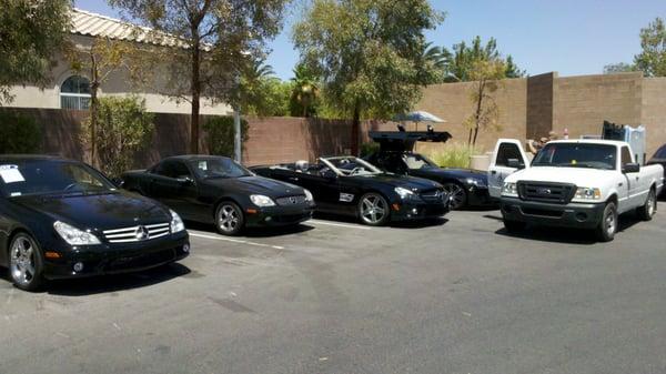 4 black Mercedes at the dealership