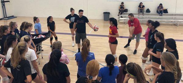 Coach Rick instructing athletes at a defense clinic.