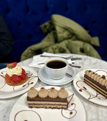 Strawberry tart, hazelnut cake, and opera cake. And regular coffee. Everything is yummy!