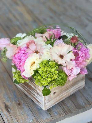 Pink Peonies, Cream Roses, Mini Hydrangea, Butterfly Ranunculus, Bear Grass in white wash wood box