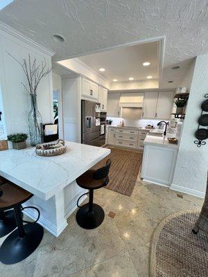 Our new refaced kitchen cabinets and quartz countertop (& backsplash) look amazing!