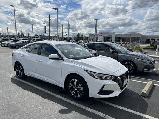 New car in white sitting next to my trade in behind it.