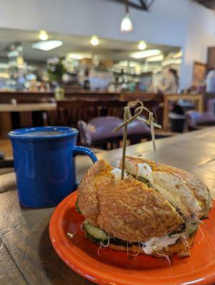 A perfect bagel sandwich and hot chocolate with almond milk