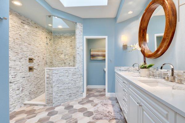 Built in cabinetry, glass wall tiles and ceramic wood look hexagon floor tiles by Ashleigh Underwood Home & Interior Design.