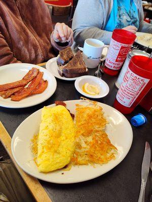 Meatlover omelette with hash browns. That's a lot of food.