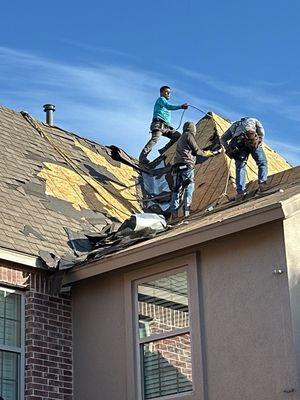 Tearing off old roof.