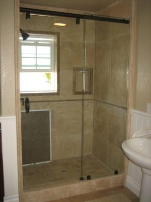 frameless glass shower door with glass clamps