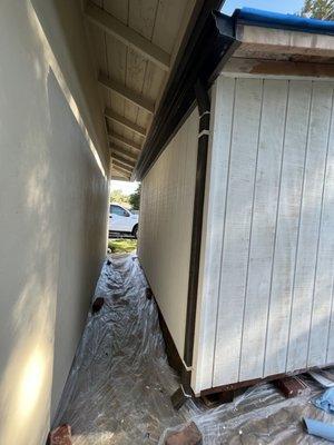 Primed gutter and downspout, ready to be painted