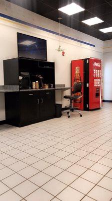 Customer waiting area with TV, Coffee/Water Station and Drink Vending Machine