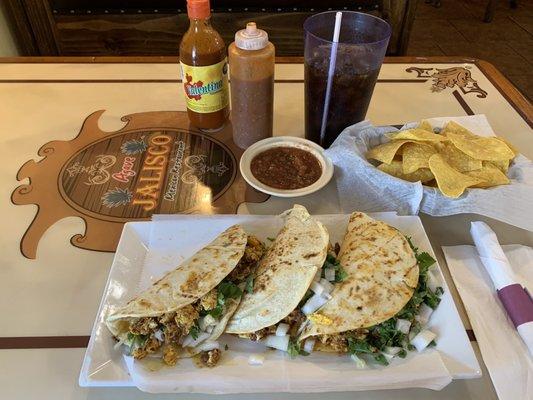 Chorizo and egg taquitos (tacos) with onions, cilantro and queso blanco