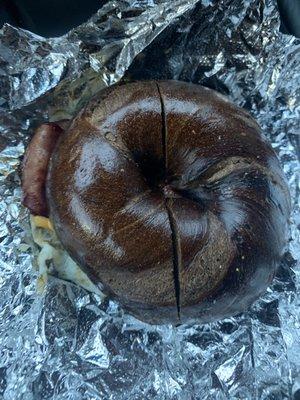 Turkey bacon egg and cheese on pumpernickel rye bagel