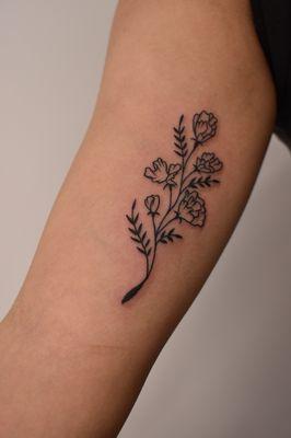 Linework flower floral blackwork tattoo