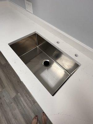 Undermount sink installed with counters. Opted for diy plumbing install.