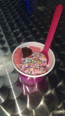 Strawberry frozen yogurt, rainbow sprinkles, strawberry wafers, and a brownie piece for my daughter. She LOVED it!