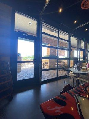 Garage doors open to a nice patio.