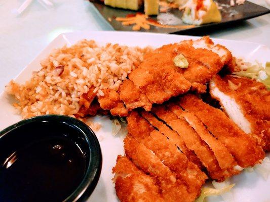 Corn breaded chicken with fried rice.