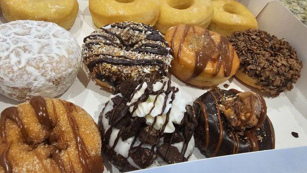 The donuts were dense and bread-like, lacking the airy, fluffy texture expected. My kids compared the glazed donuts to hamburger buns.