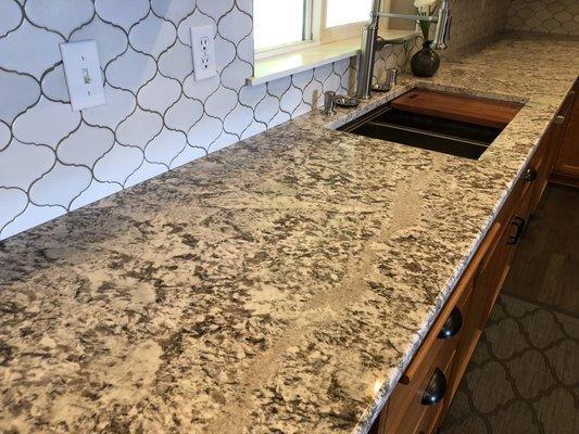 Ryan took special care to place pieces exactly where requested. The " river" runs through our sink area to show pattern