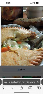 This is a pot pie with chicken, potatoes peas and carrots with a crust.