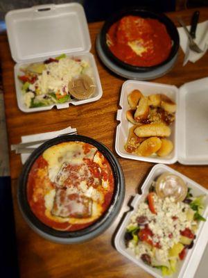 Two salads, eggplant rollatini, and chicken parm