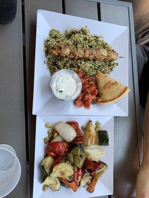 Samos platter with grilled chicken, sides of rice pilaf and roasted vegetables