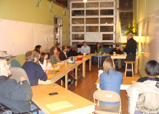 All our desks are on wheels so we can arrange the room in many ways for classes and events. Notice the white boards!