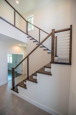 Cable hand railing system with stain wood stairs