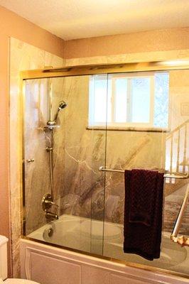 Framed Shower Tub Enclosure with Gold Hardware in Clayton, CA