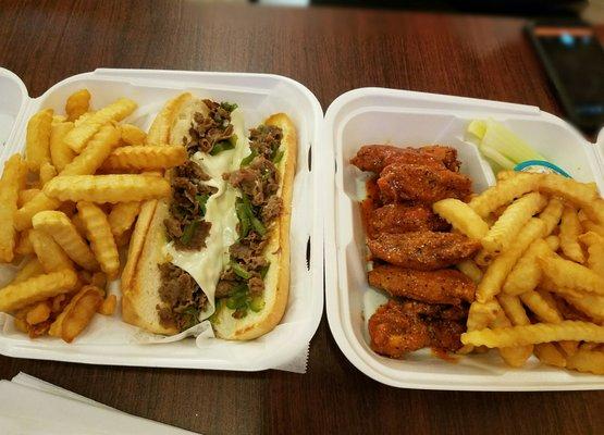 Beef Philly cheese steak, fries and hot wings sprinkled with lemon pepper