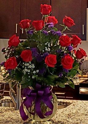 I asked for red roses and something purple and this gorgeous bouquet is what they designed. I couldn't have imagined it prettier.