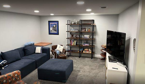 Basement remodel: new carpet, vinyl flooring, drywall, fresh paint, stabilized ceiling joists.