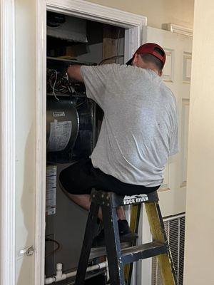 Adam wiring the indoor part of the split system heat pump.