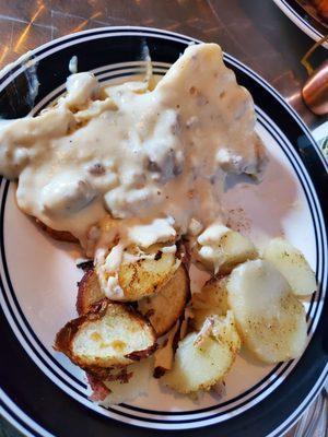 Biscuits and gravy (half portion) with potatoes