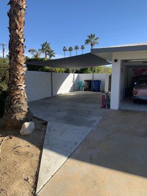 Carport shade using Sunbrella Contour fabric. Color is apex charcoal . 6 point connections