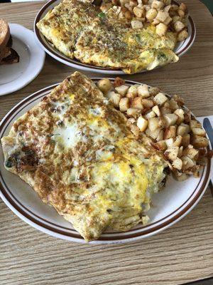 Huge 5 egg omelettes. Meat one is behind the steak pepper and cheese one